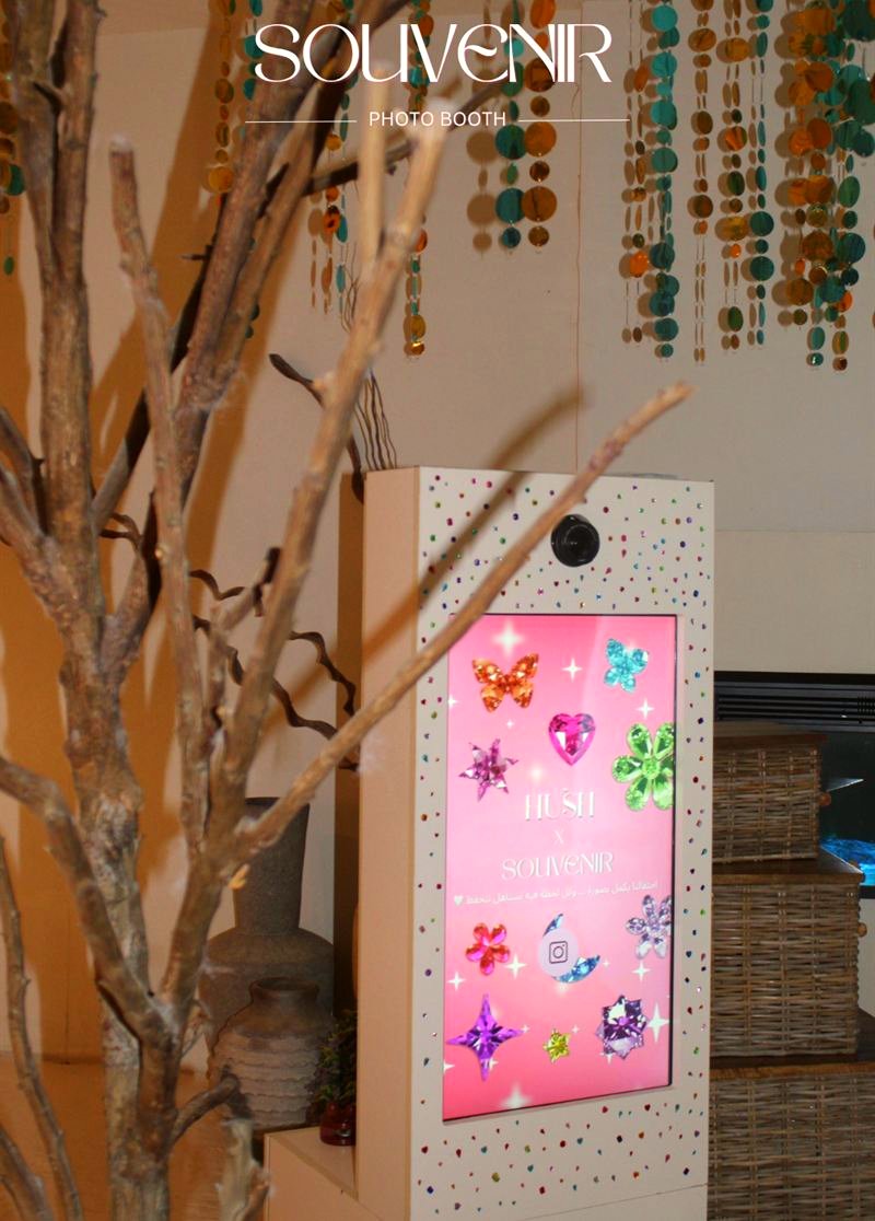 Booth with decorative branches at a spa event