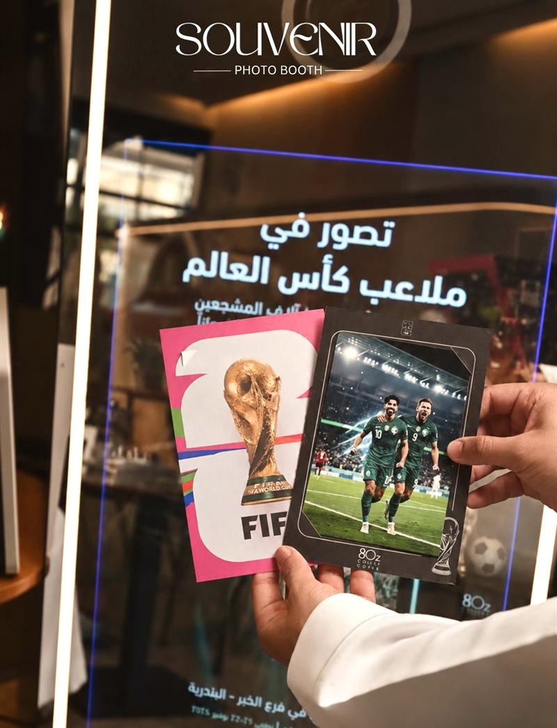 World Cup themed print held in front of the booth